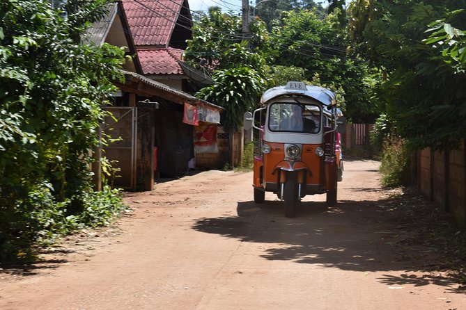 Full-Day Guided Tuk Tuk Chiang Mai Adventure and Rafting - A mountainside temple and working monks