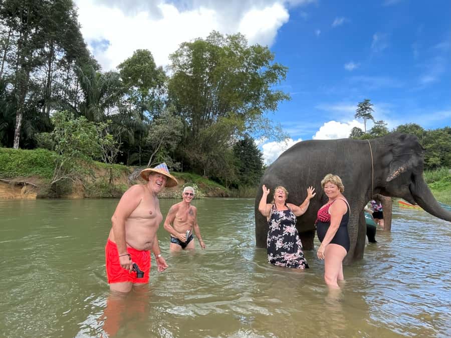 Khao Sok: Elephant Day Care, & Bamboo Rafting Day Tour - Phanthurat Temple and the final return