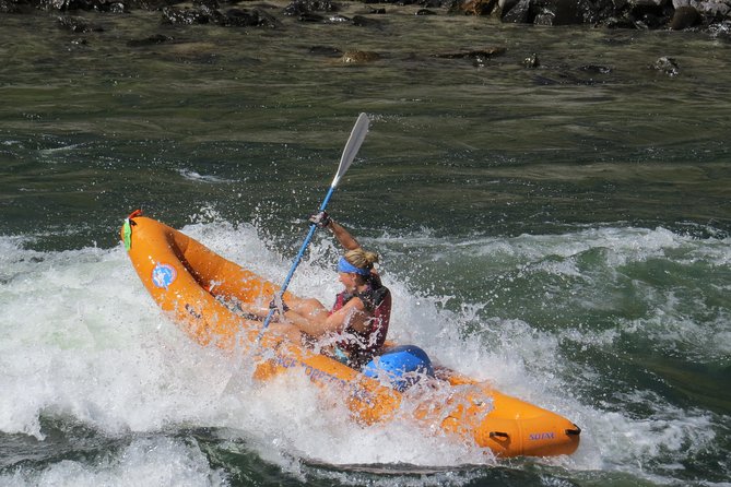 Riggins Idaho 1-day Rafting Trip on the Salmon River - Inflatable kayaks get a surfing session